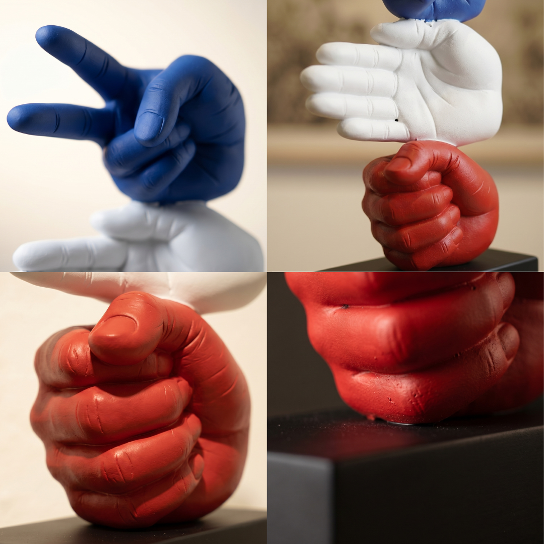Collage of hands in various poses made from different colored materials.
