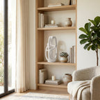 Wooden bookshelf with decorative items in a living room setting
